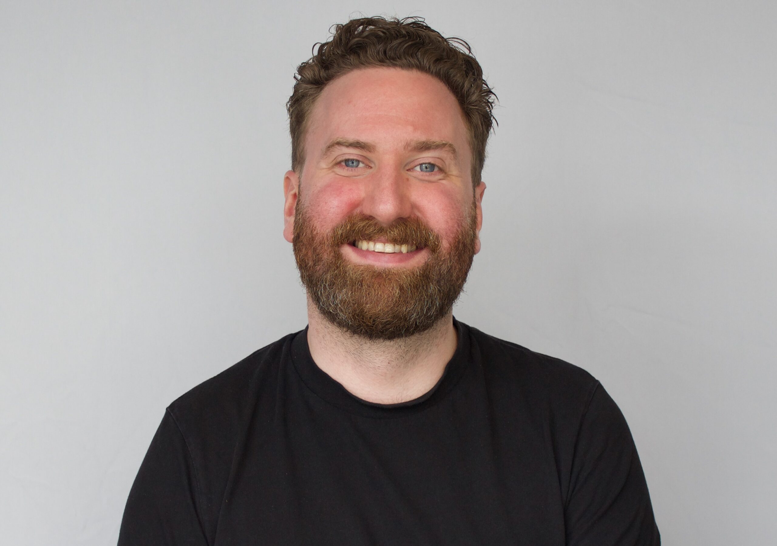 Portraitfoto eines Teilnehmenden als Testimonial